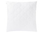 Ein weißes, gestepptes Kissen mit einem wellenförmigen Design.