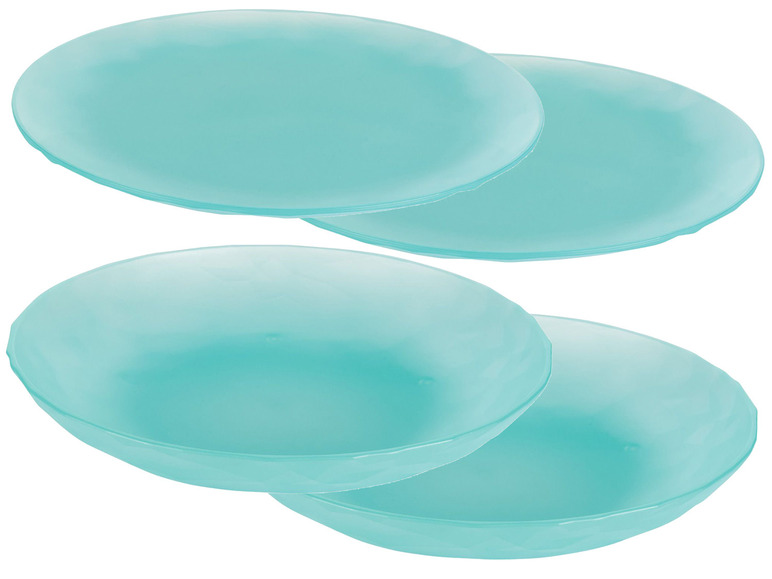 Vier türkisfarbene Teller.