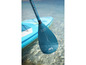 Ein Aqua Marina Paddleboard mit Paddel im Wasser.