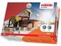 Märklin My World Spielset mit einem Kran und einer Ladestation.