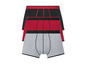 Drei Boxershorts in Schwarz, Rot und Grau.