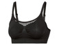 Schwarzer Sport-BH mit Mesh-Einsatz.