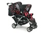 Doppelkinderwagen mit schwarz-weißem Punkte-Muster und roten Akzenten