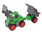 Ein grüner Spielzeugtraktor mit einem grauen Anhänger.