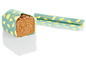 Eine Scheibe Brot, verpackt in Ernesto Bio-Verpackungspapier mit Zitronenmuster.
