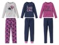 Drei Mädchen-Pyjamas mit Blumenmuster und Schriftzügen wie 'Be magical' und 'Spirit of the flower'.