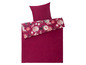 Ein weinrotes Bettbezug-Set mit einem Kissenbezug mit Blumendruck.