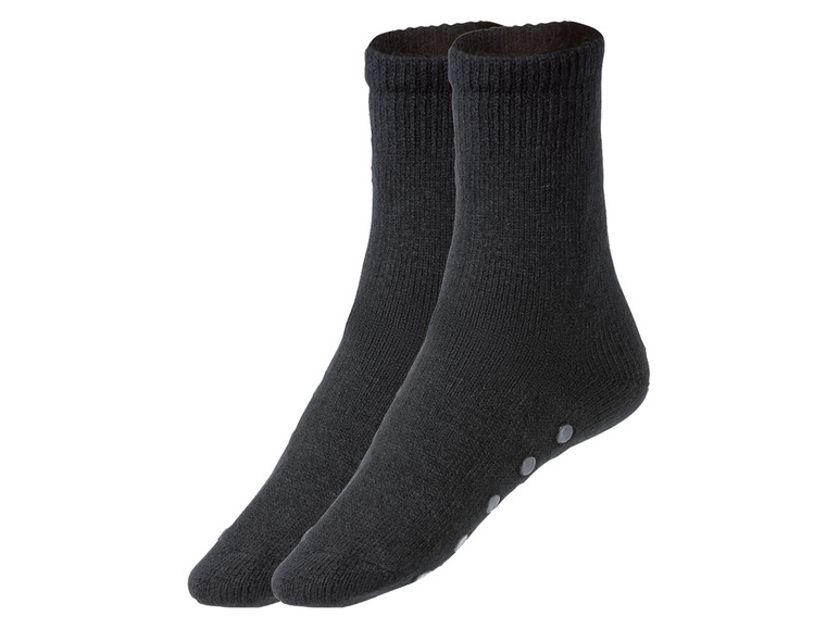 Zwei Paar schwarze Socken mit Anti-Rutsch-Punkten.