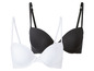 Zwei schwarze und weiße BHs.