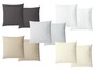 Vier Kissenpaare in Grau, Weiß, Hellgrau und Beige.