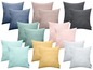 Kissen in verschiedenen Farben, darunter Grau, Rosa und Hellblau.
