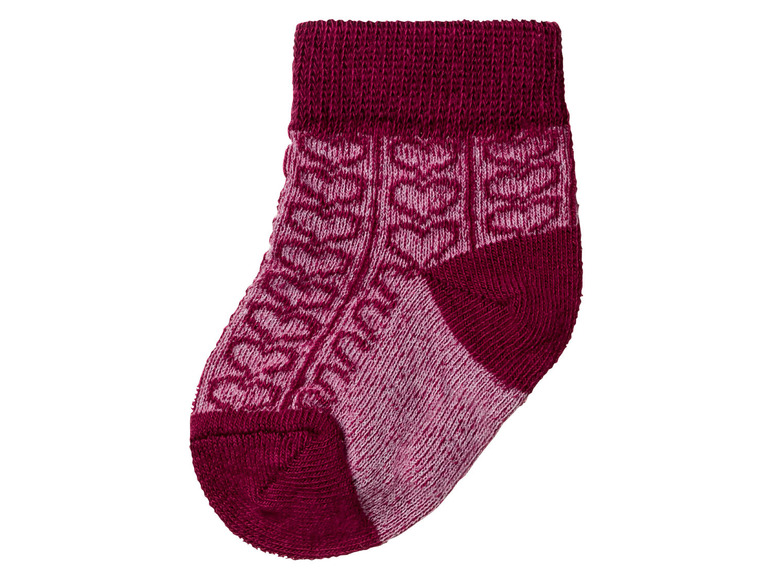 Eine rosa und rote Socke mit Muster.