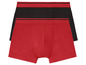 Zwei Paar Boxershorts, eine rote und eine schwarze.