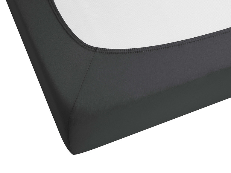 Ein dunkelgraues Spannbettlaken für eine Matratze.