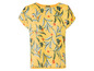 Gelbe Bluse mit tropischem Blumendruck.