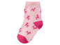 Eine rosa Socke mit rosa Pudeln.