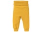 Gelbe Babyhose mit elastischem Bund.