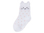 Weiße Socke mit rosa Punkten und Katzenkopf.
