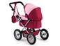 Ein rosa und roter Puppenwagen mit einer Handtasche.