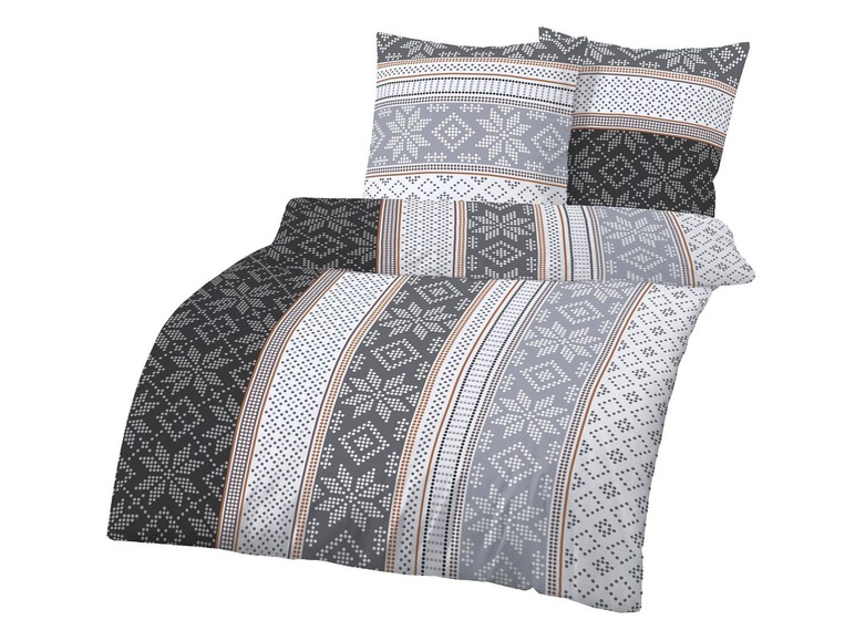 Graue Bettwäsche mit geometrischem Muster.