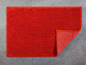 Roter Badteppich mit Textur