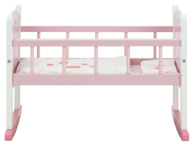 Ein rosa Holz-Babybett mit Schaukelfüßen für Puppen.