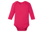 Ein rosafarbenes Baby-Langarmbody