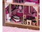 Ein Puppenhaus mit Badezimmer, Küche und Esszimmer.