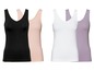 Vier Tanktops in Schwarz, Rosa, Weiß und Lila.