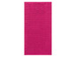 Ein rosafarbener Badeteppich mit Rippenstruktur.