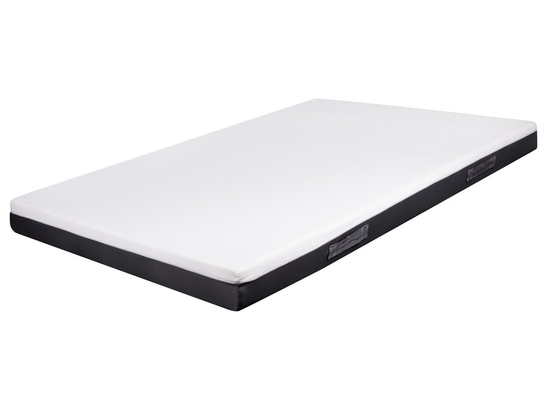 Eine weiße Matratze mit grauen Rändern.