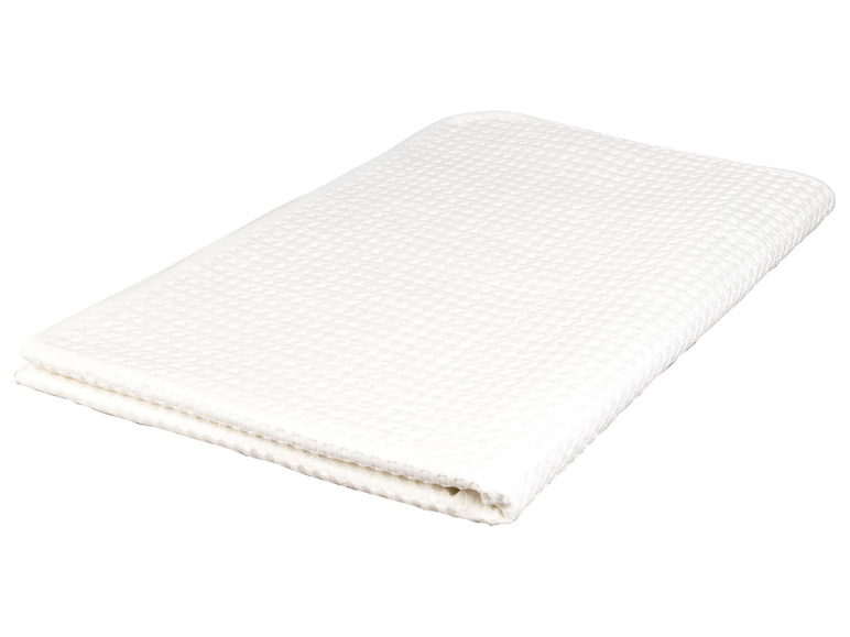 Ein weißes Frotteehandtuch gefaltet.