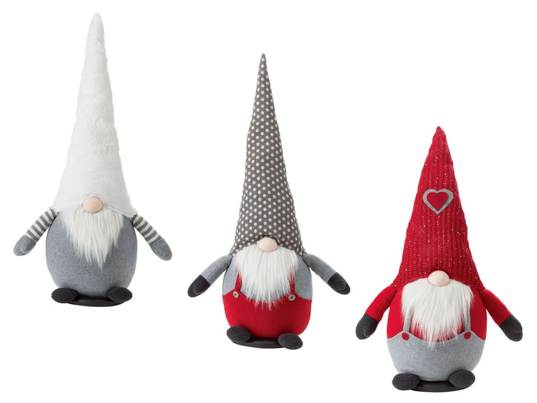 Drei Weihnachtszwerge mit verschiedenen Hüten: grau, weiß und rot mit weißen Punkten.