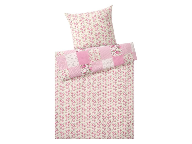 Ein rosafarbenes Bettbezugset mit Blumenmuster, einschließlich Kissenbezug.