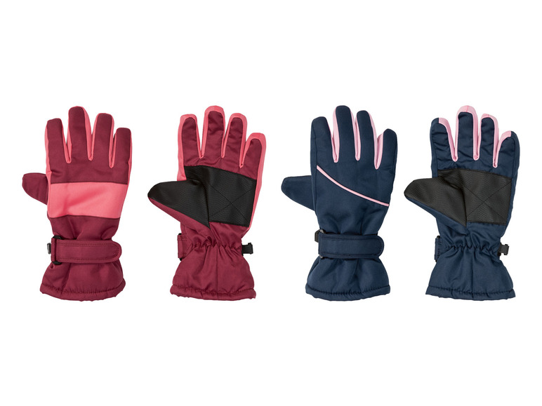 Vier Paar Winterhandschuhe in Rot und Blau mit rosafarbenen Details.