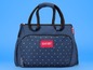 Eine blaue Badabulle Wickeltasche mit weißem 'X'-Muster und dem Schriftzug 'Oh My Baby!'.
