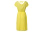 Gelbes Kleid mit kurzen Ärmeln und Schleife im Nacken.