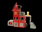 Ein rotes Feuerwehrhaus aus magnetischen Bausteinen mit einer Figur.