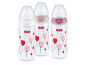 Drei NUK Babyflaschen mit Blumenmuster.