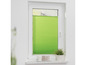 Grüne Plissee-Rollos an einem Fenster.