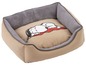 Beige Hundebett mit Snoopy-Druck.