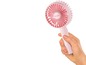 Ein rosa Handventilator der Marke Unold.