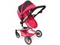 Rosa Kinderwagen mit schwarzen Punkten.
