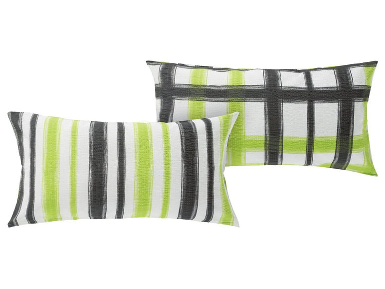 Zwei Kissen mit grünen und schwarzen Streifen.