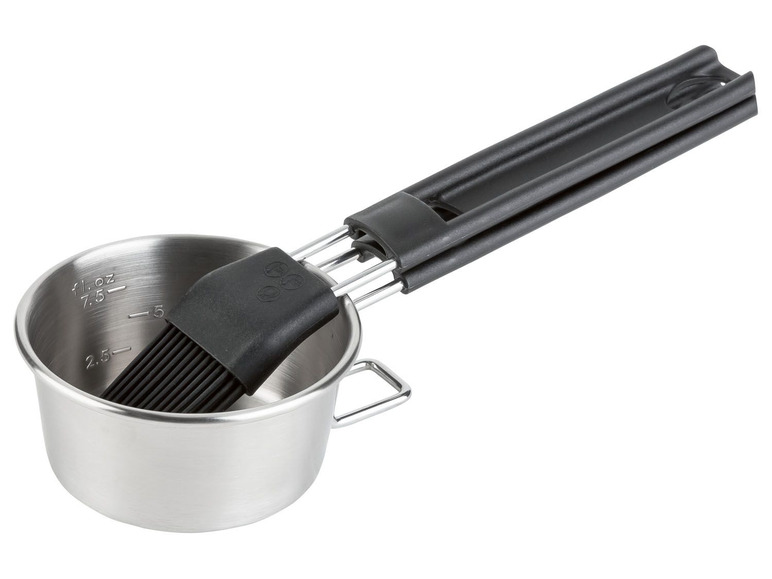 Ein Edelstahlmessbecher mit integriertem Silikonpinsel.