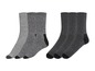 Drei Paar grau-schwarze Socken.