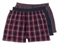 Drei Paar Boxershorts in rot-schwarzem Karo-Muster.