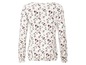 Weiße Bluse mit langen Ärmeln und Blumenmuster.