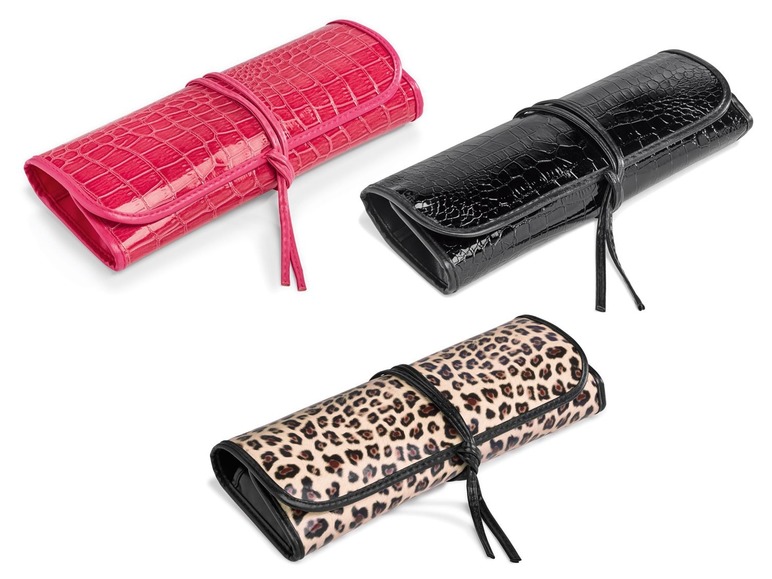 Drei Make-up-Pinselrollen in rosa, schwarz und Leopardenmuster.