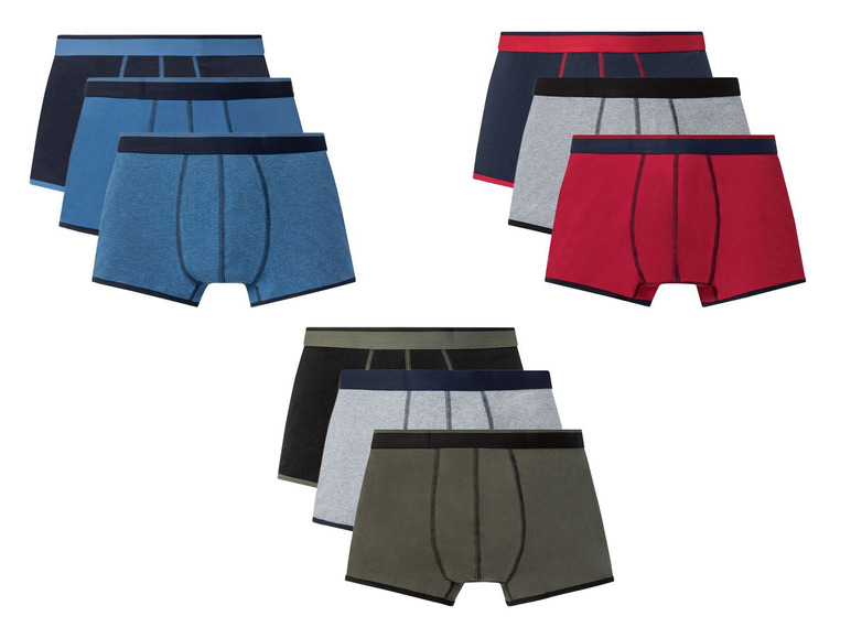 Drei Paar Herren-Boxershorts in verschiedenen Farben.